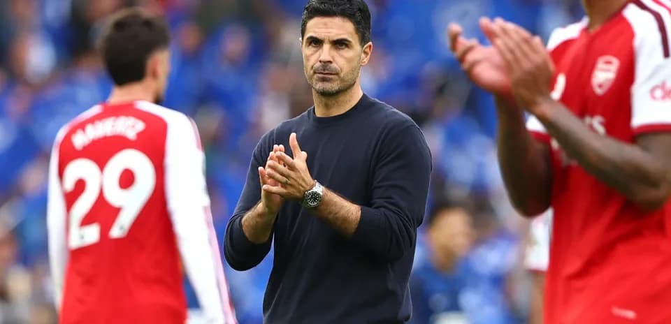 Manager applauding players after the match
