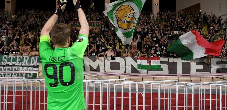 Goalkeeper celebrating with fans after match
