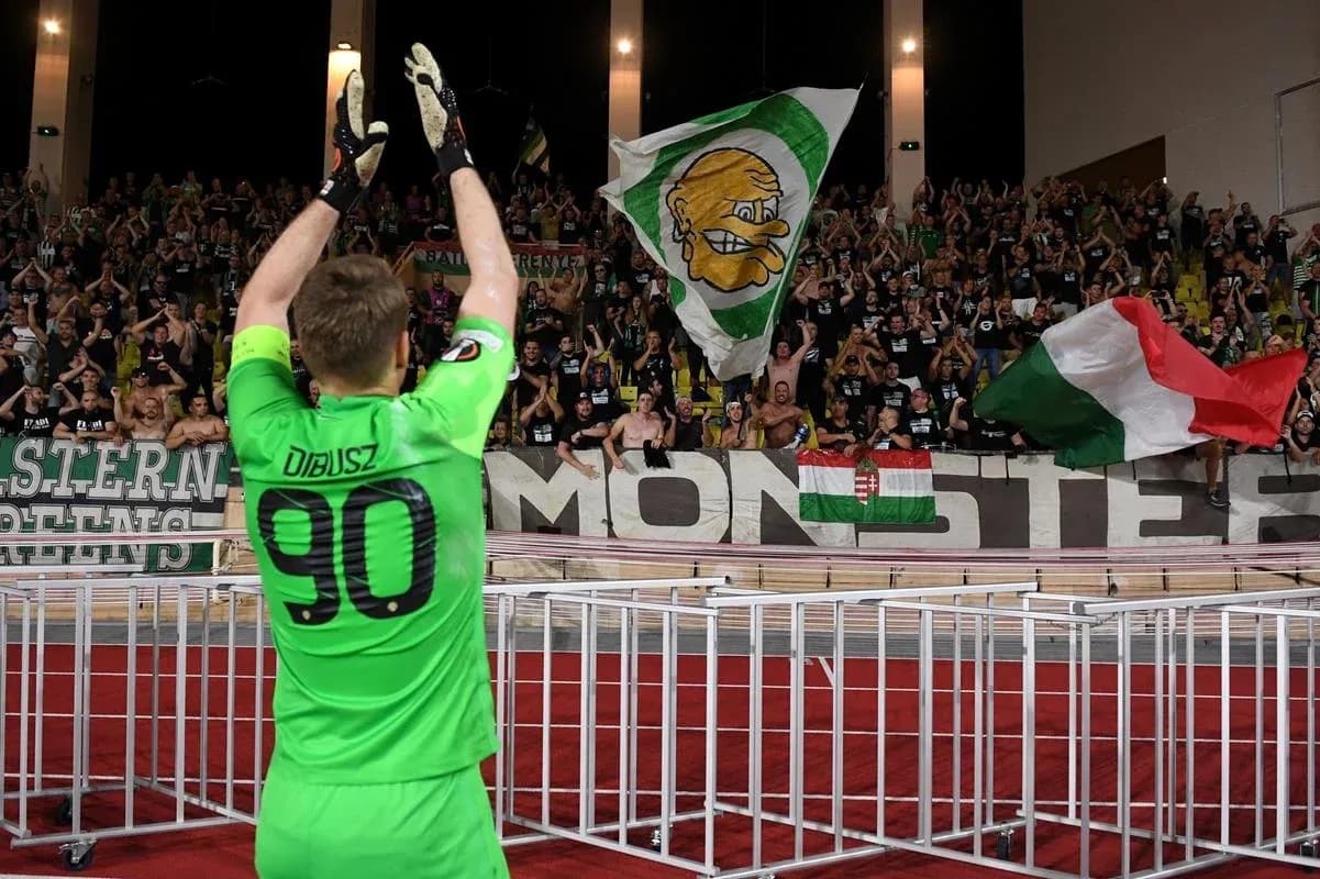 Goalkeeper celebrating with fans after match