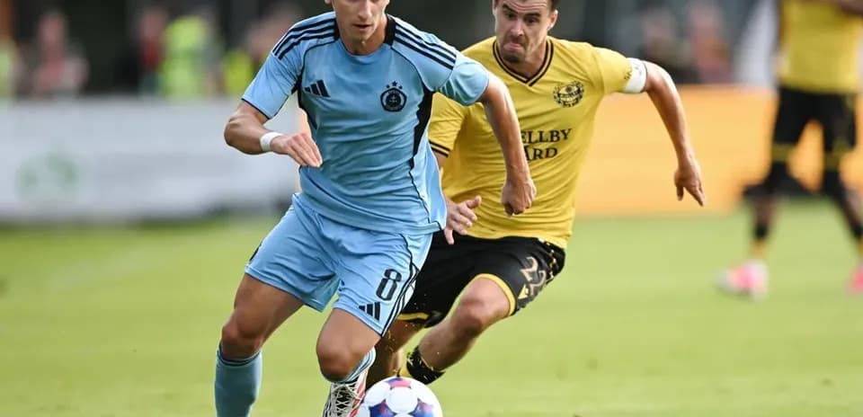 Player running with the ball during football match