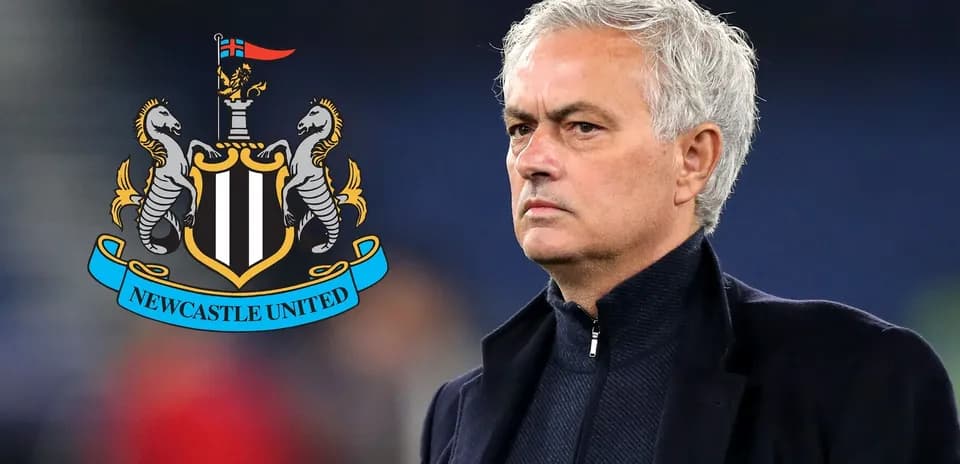 Coach standing next to Newcastle United logo