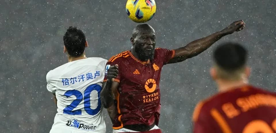 AS Roma player heading the ball during match