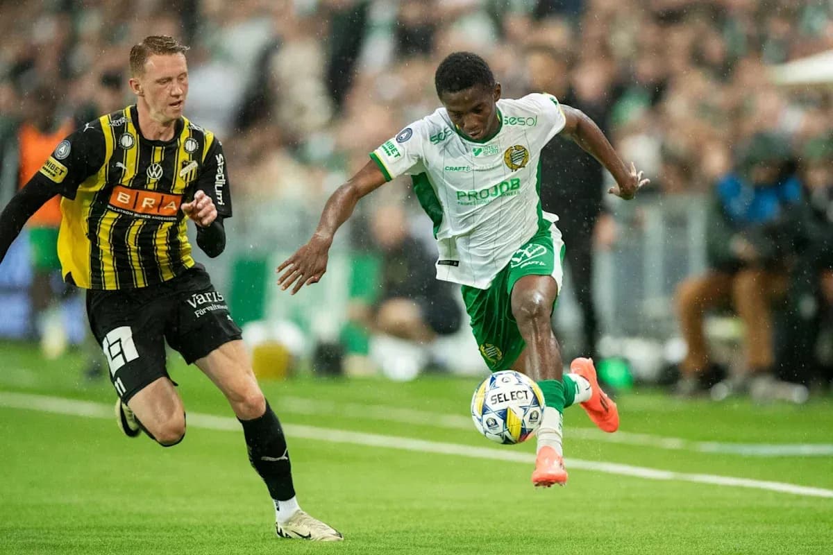Player dribbling past opponent during a match