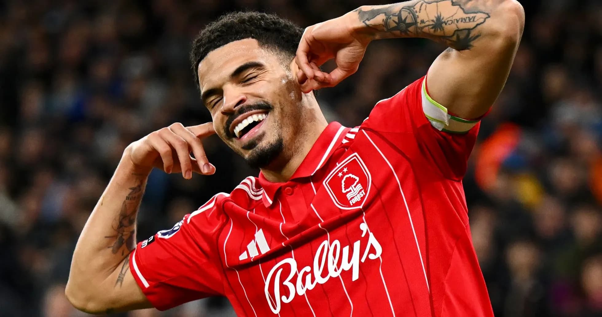 Player celebrating a goal in red team jersey