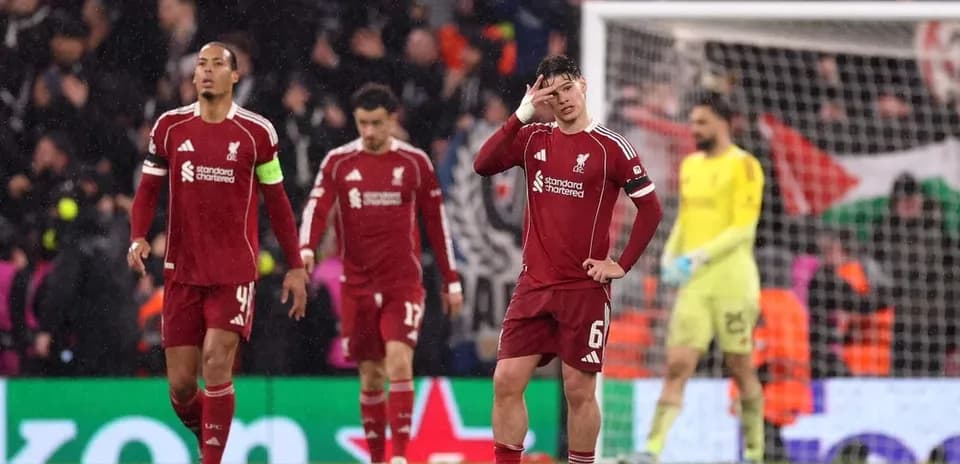 Liverpool players walking off the pitch after match