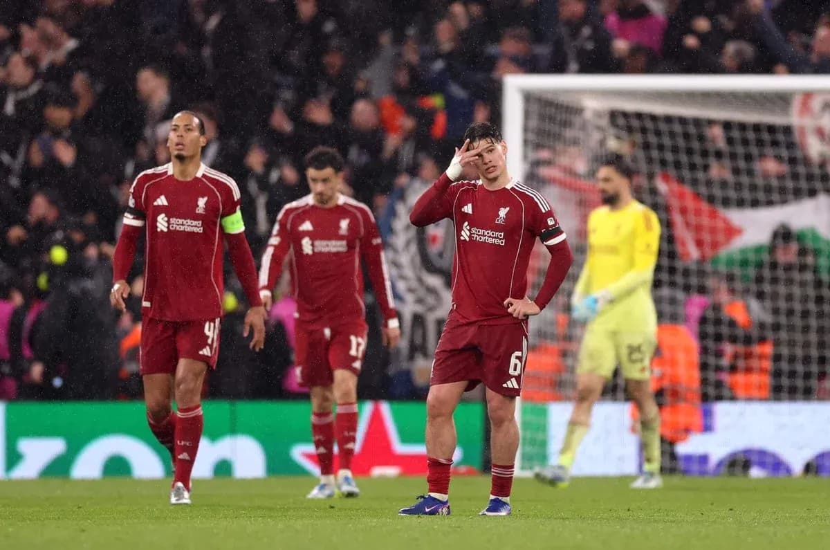 Liverpool players walking off the pitch after match