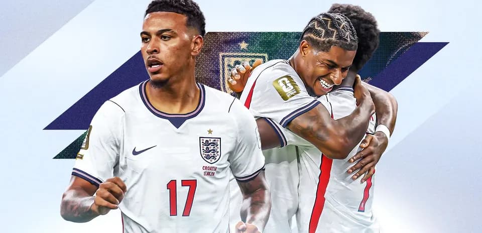 Two England players celebrating a goal together