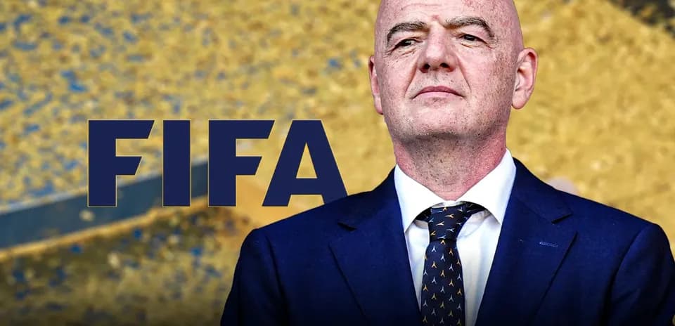FIFA president standing against a golden background