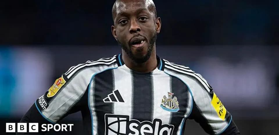 Newcastle player wearing black and white jersey