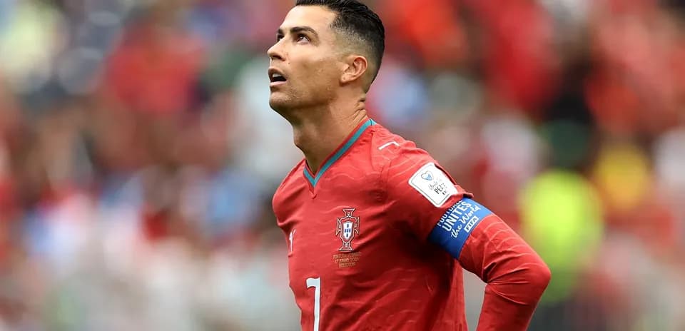 Player in red jersey looking up during match