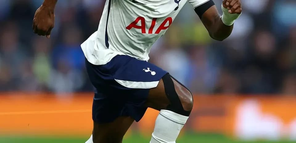 Player sprinting with ball during match for Tottenham