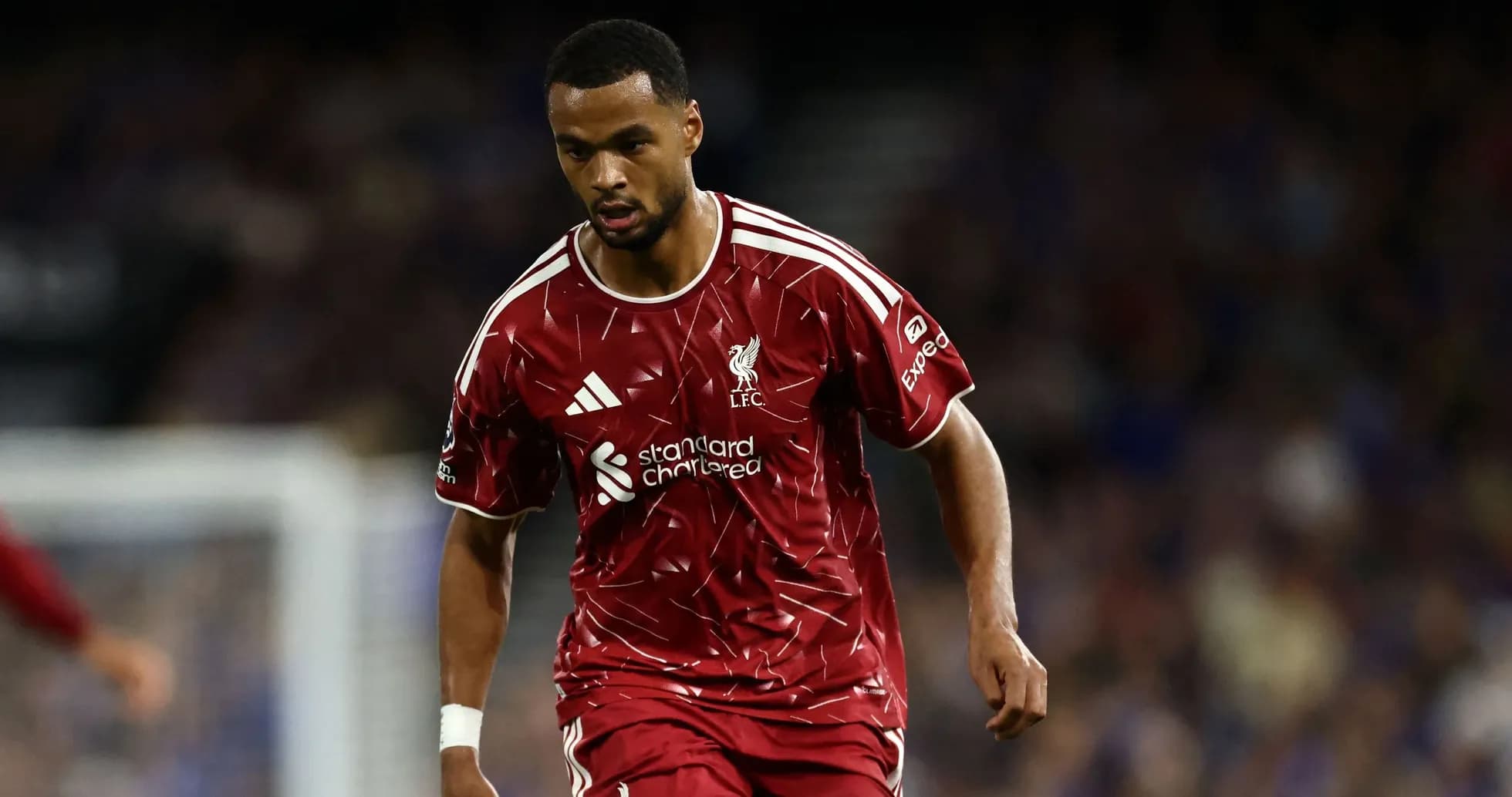 Player in Liverpool kit running during match