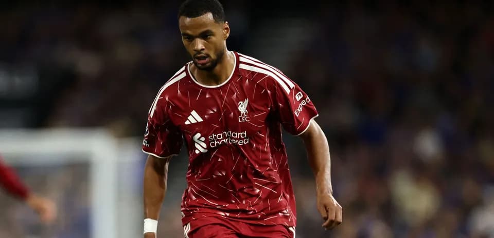 Player in Liverpool kit running during match