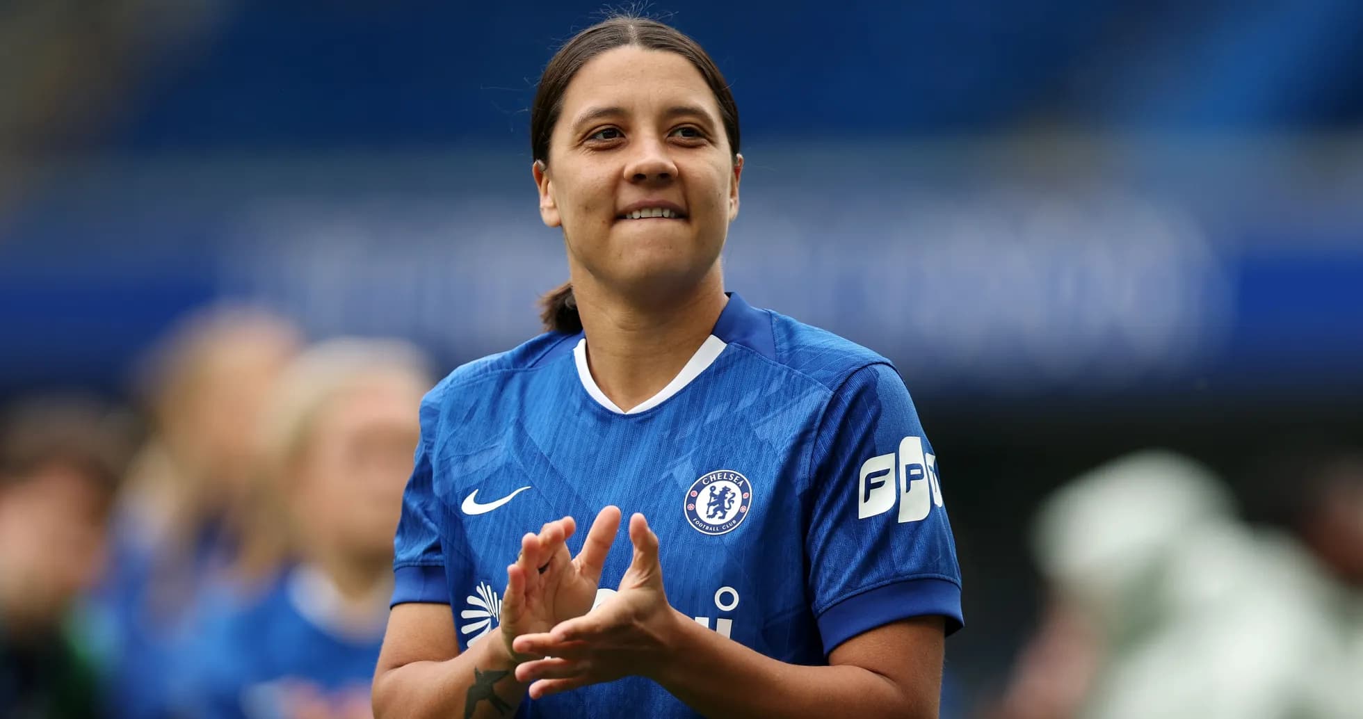 Player applauding while wearing Chelsea jersey