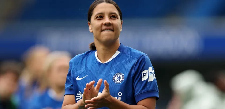 Player applauding while wearing Chelsea jersey