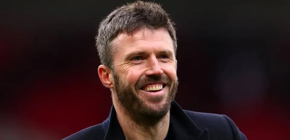 Man smiling in a sports venue setting