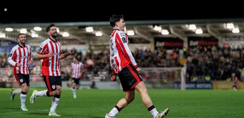 Player celebrating goal with teammates during match
