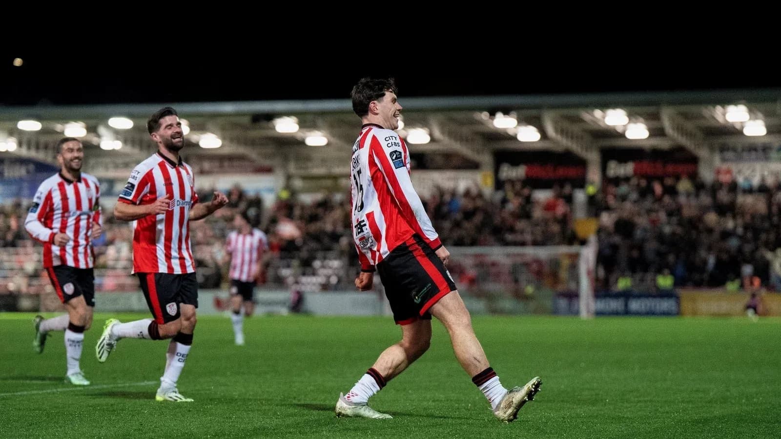 Player celebrating goal with teammates during match