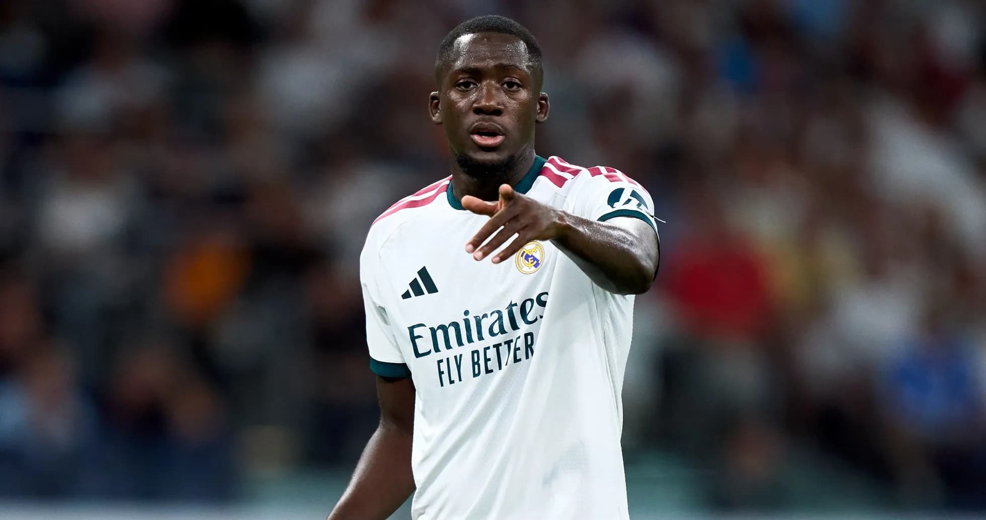 Player gesturing during a match for Real Madrid