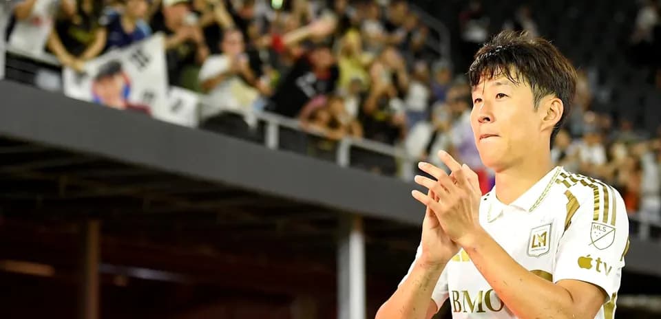 Player applauding fans after the match