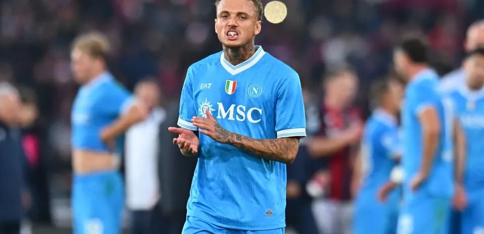 Player gesturing during match wearing Napoli jersey