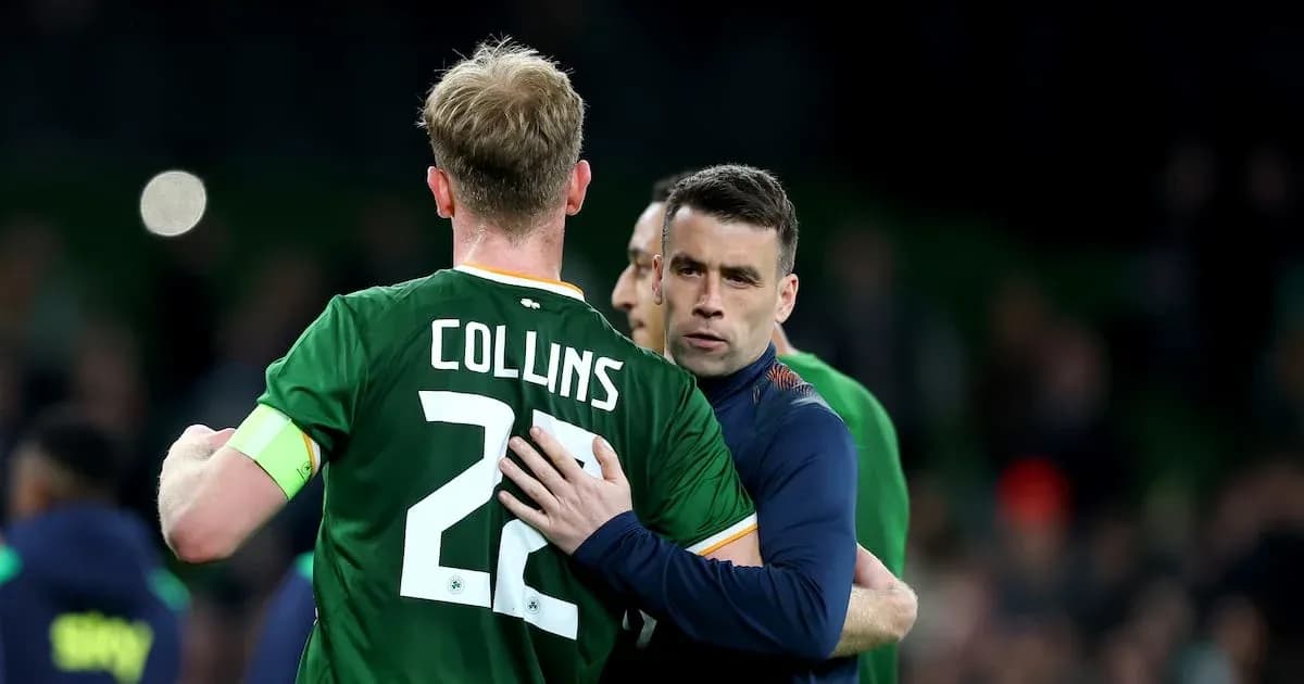 Players embracing on the pitch after the match