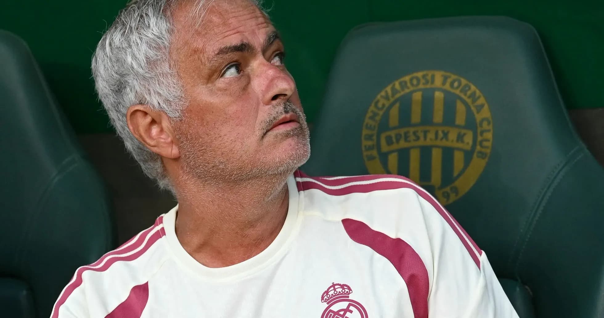 Coach sitting on the bench during a match