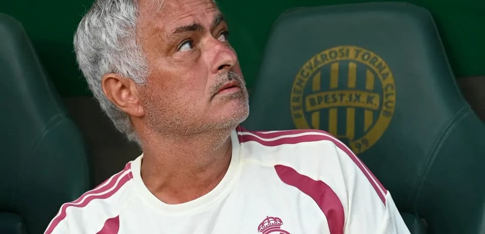 Coach sitting on the bench during a match