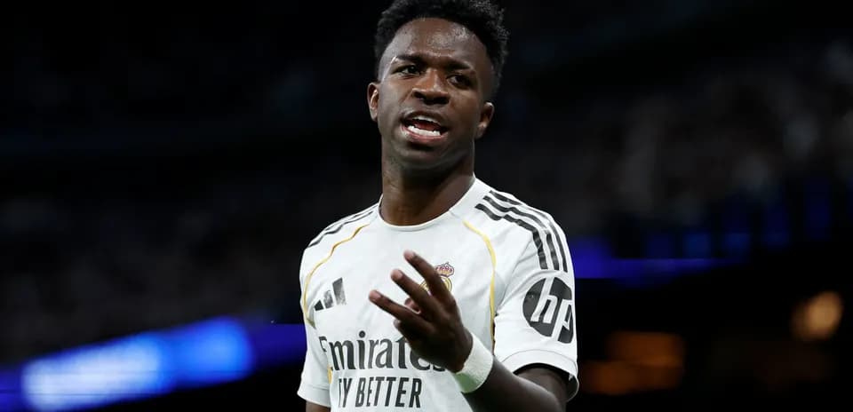 Player gesturing during a match in white jersey
