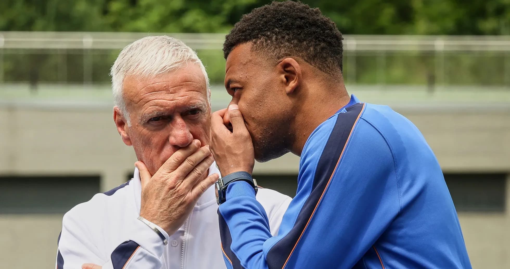 Coach and player discussing strategy during training