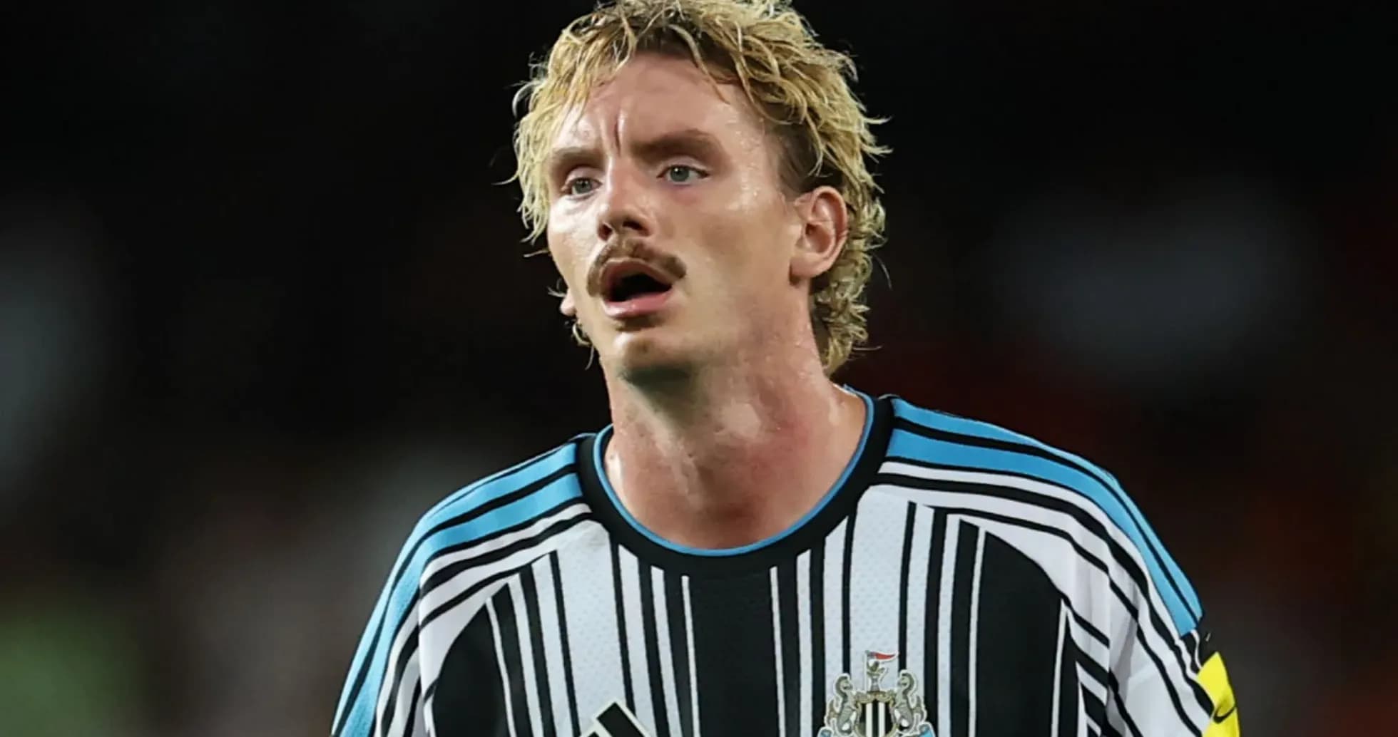 Newcastle United player in striped goalkeeper jersey