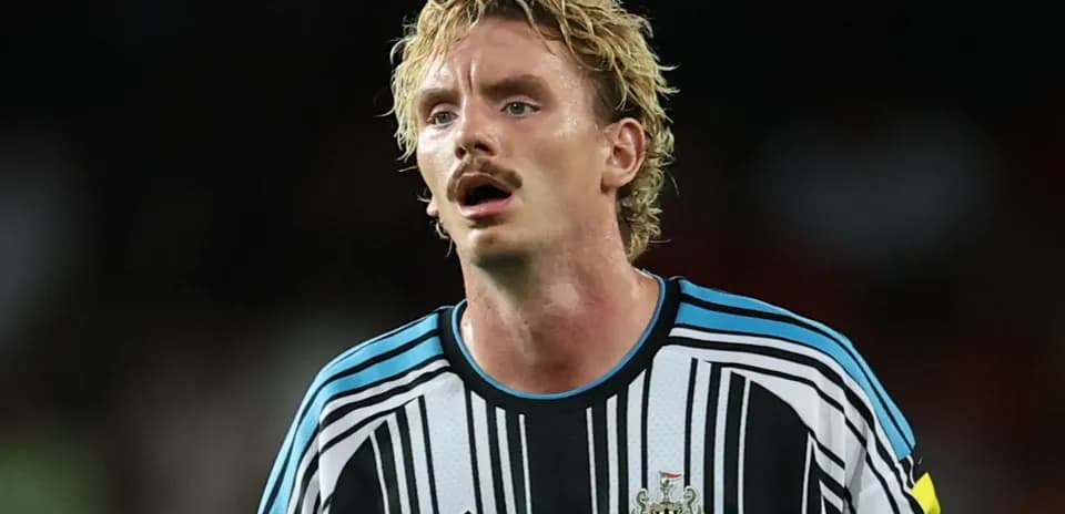 Newcastle United player in striped goalkeeper jersey