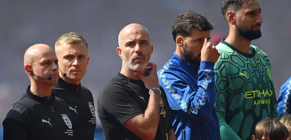 Referees and players lined up before match