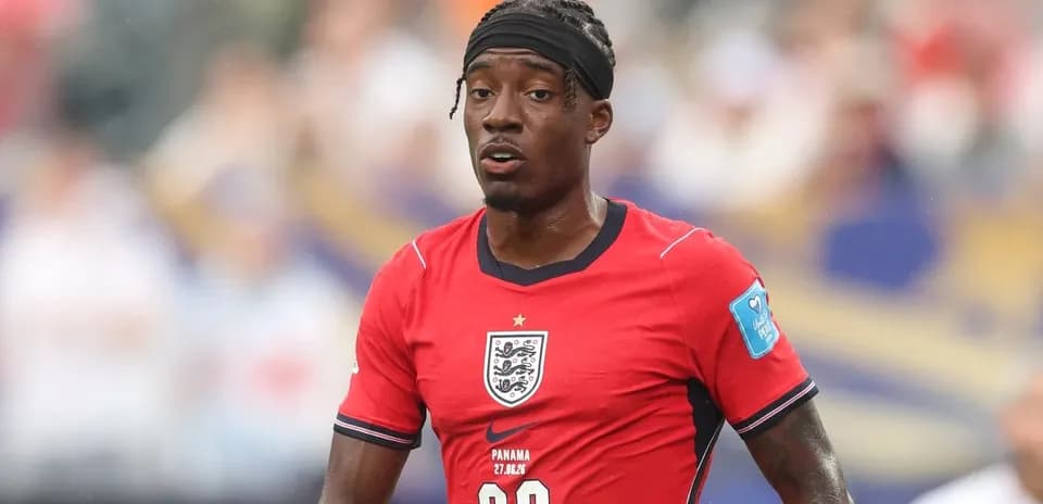 Player wearing red England jersey during match