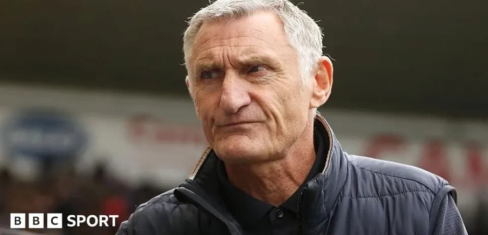 Manager looking thoughtful before the match
