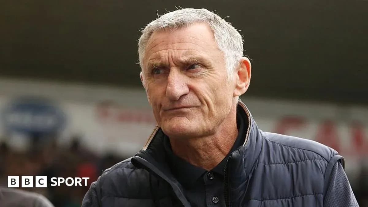 Manager looking thoughtful before the match