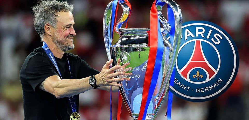 Coach celebrating with UEFA Champions League trophy