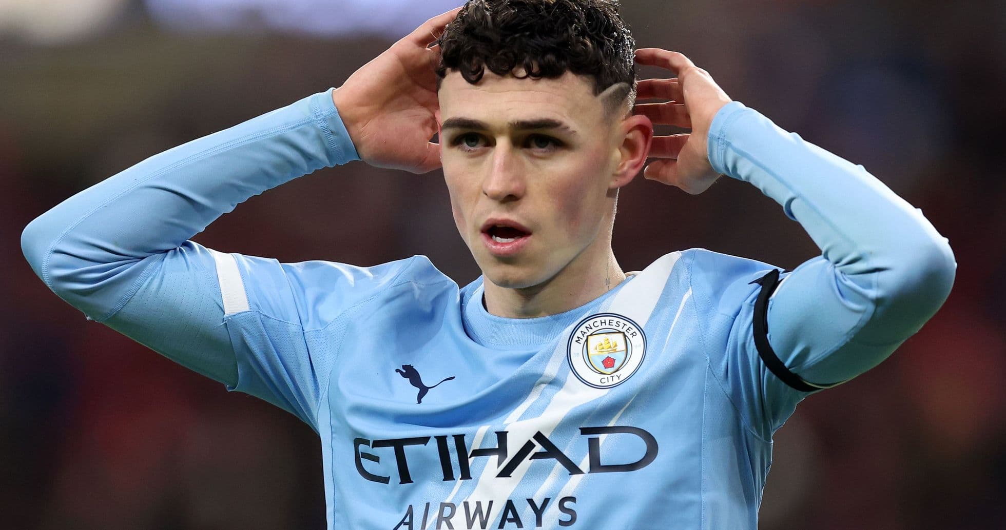 Phil Foden reacting during a Manchester City match