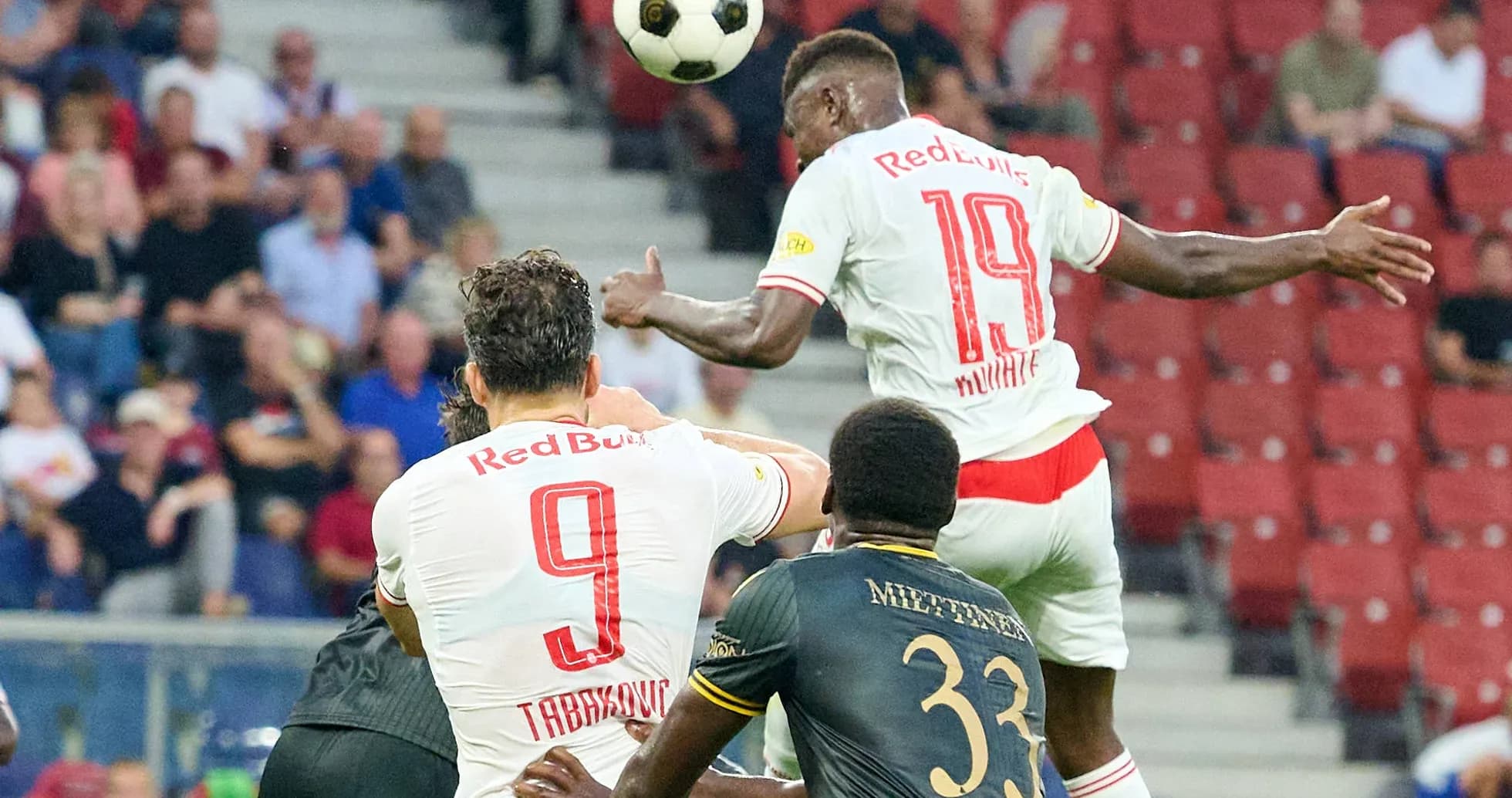 Red Bull Salzburg players competing for a header