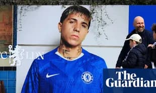 Player in Chelsea jersey displayed on wall