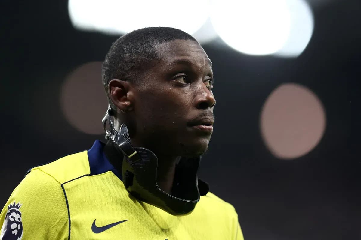 Player in yellow kit wearing a neck brace