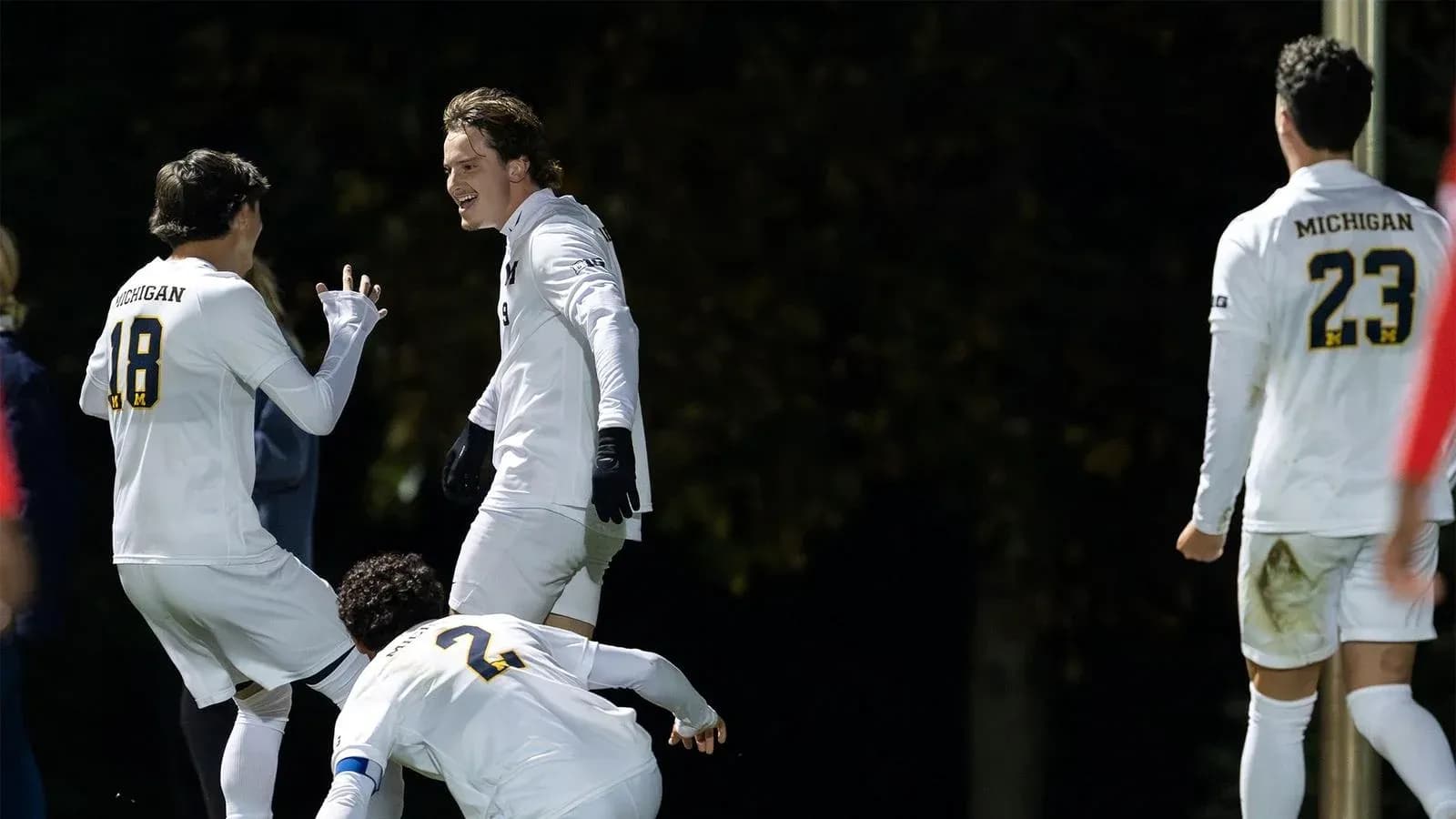 Michigan players celebrating a goal during match