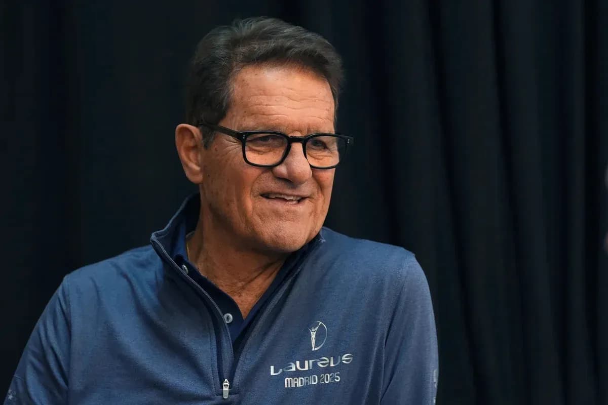 Man in glasses speaking at an event