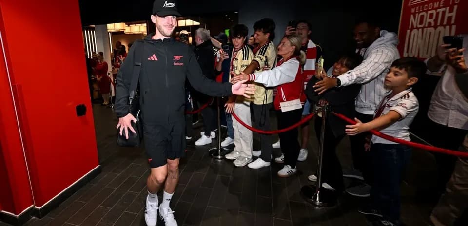Player greeting fans at entrance before match