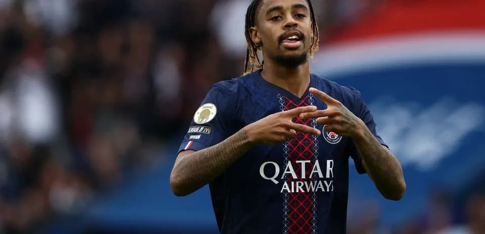 Player gesturing during match in PSG jersey
