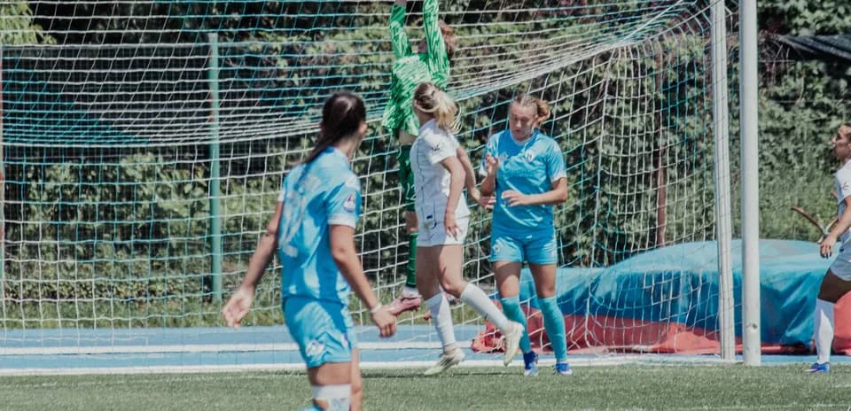Goalkeeper catching the ball during match