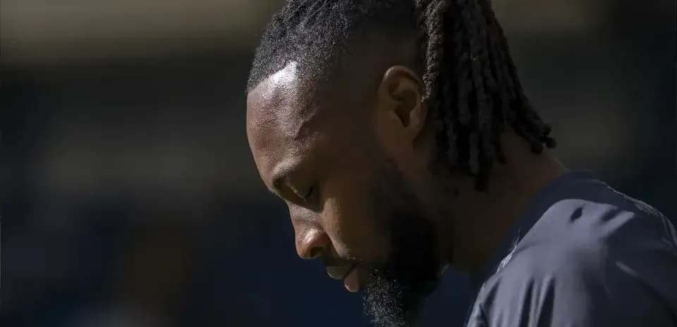 Player looking down during warm-up before match