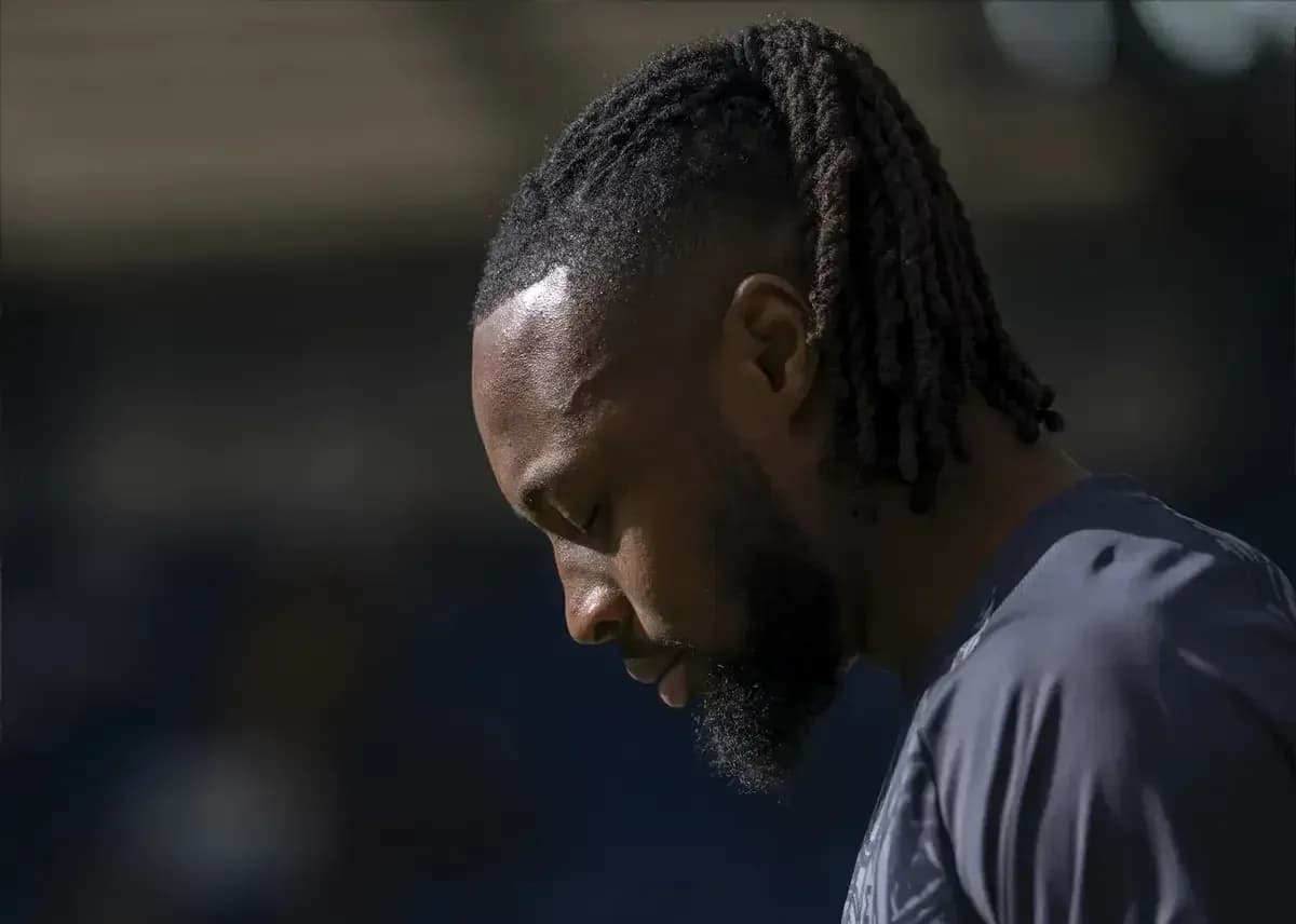 Player looking down during warm-up before match