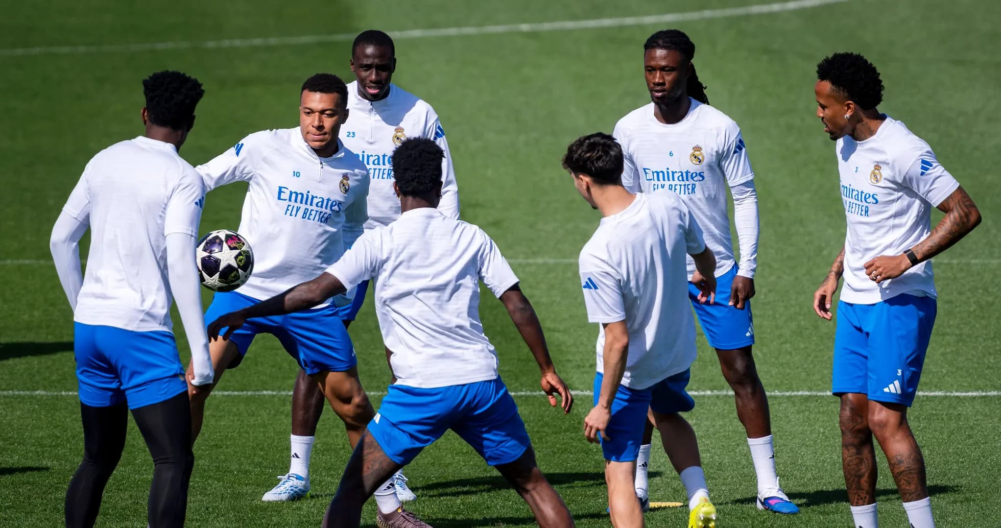 Real Madrid players training with a soccer ball