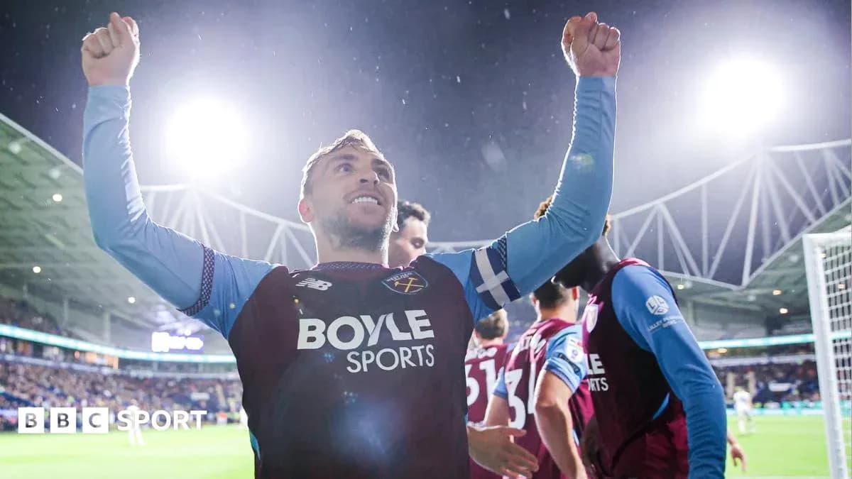 Player celebrating a goal with raised arms